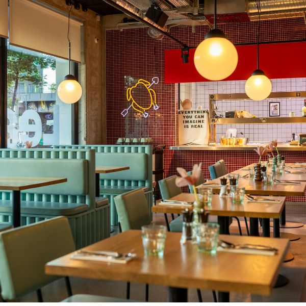 Restaurant interior with a visible air conditioning system helping regulate temperature and ensure a pleasant atmosphere for diners.