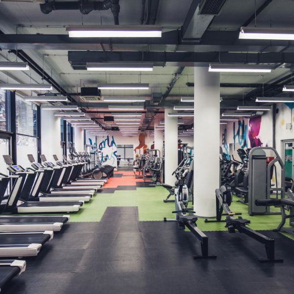 Ceiling-mounted AC unit fitted in a fitness centre to provide even airflow during workouts