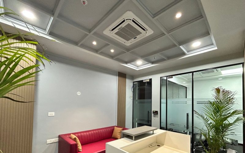 Ceiling cassette air conditioner installed in an office lobby, providing even cooling and maintaining a comfortable temperature for visitors.